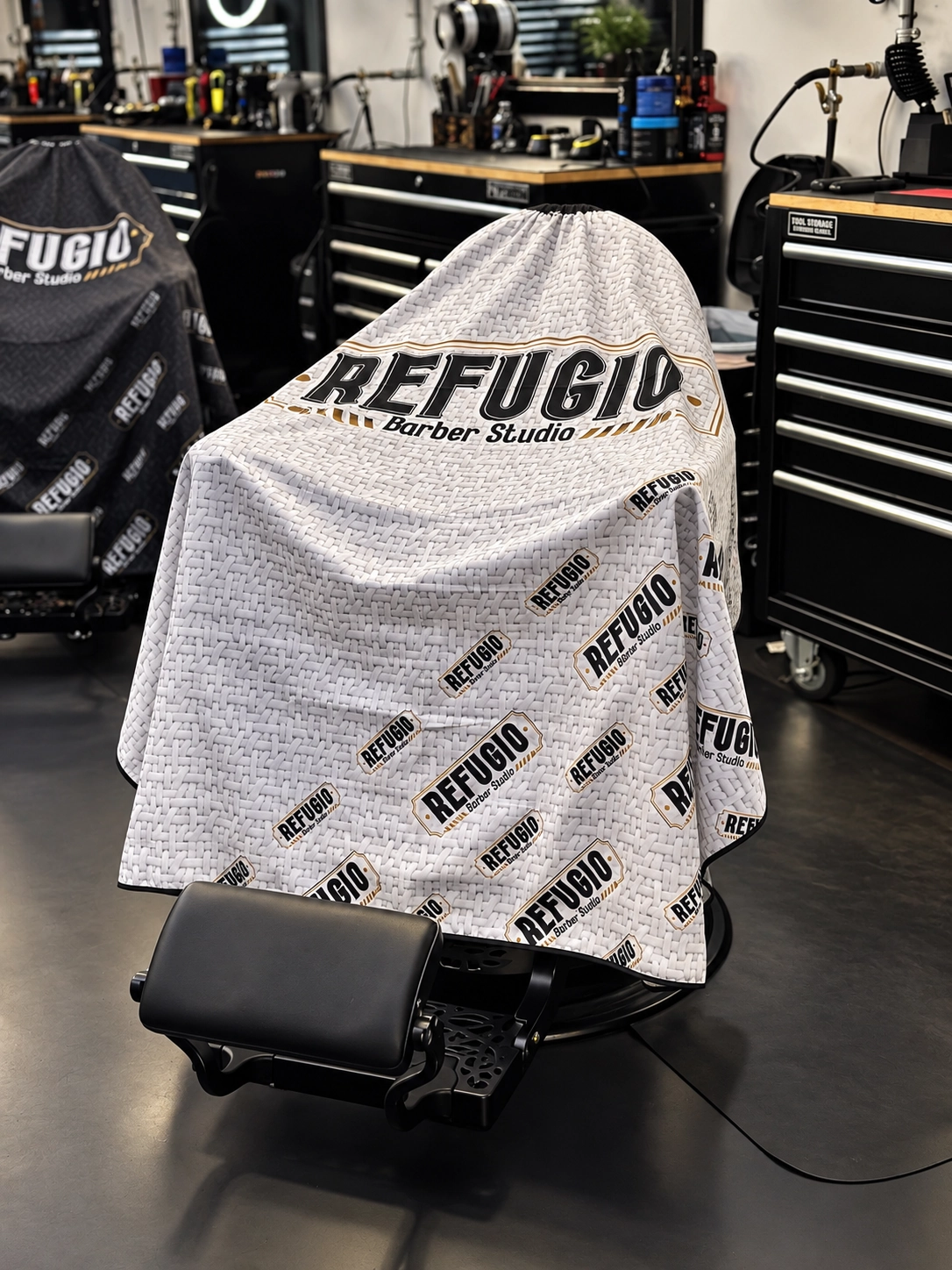 Barber chair under Refugio Barber Studio’s white cape